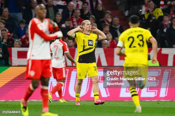 Julian Ryerson of Dortmund celebrates after scoring his team's second goal during the Bundesliga match between FC Bayern München and Borussia...