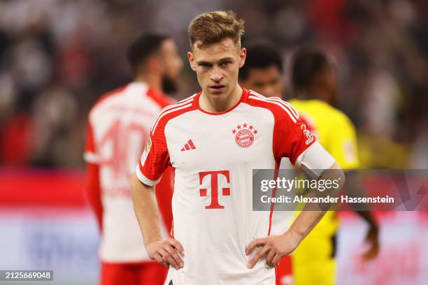 Joshua Kimmich of Bayern Munich looks dejected at full time following the team's defeat during the Bundesliga match between FC Bayern München and...