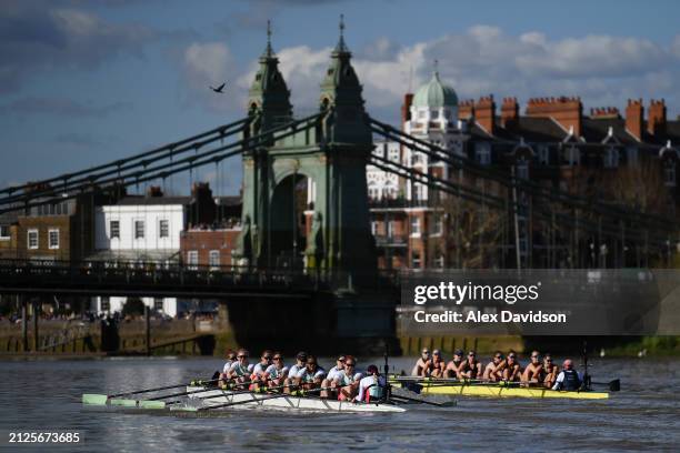 Cambridge and Oxford pass by Hammersmith bridge during The Gemini Women's Boat Race 2024 on March 30, 2024 in London, England.