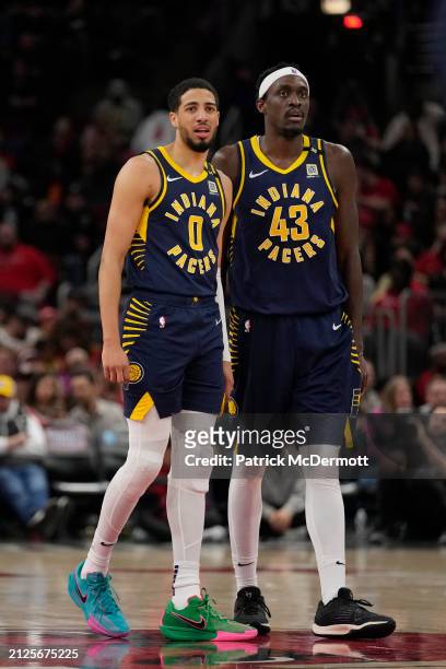 Tyrese Haliburton and Pascal Siakam of the Indiana Pacers look on during the second half against the Chicago Bulls at the United Center on March 27,...