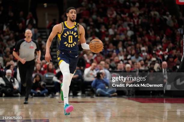 Tyrese Haliburton of the Indiana Pacers dribbles the ball during the second half against the Chicago Bulls at the United Center on March 27, 2024 in...