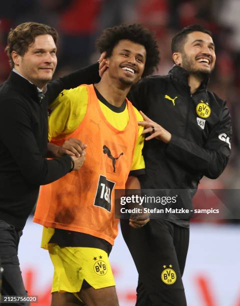 Trainer Edin Terzic head coach of Borussia Dortmund Karim Adeyemi of Borussia Dortmund and Nuri Sahin celebrate with the fans after their sides...