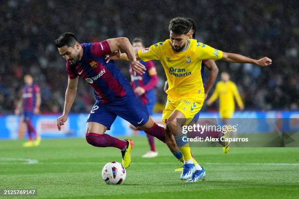 Ilkay Guendogan of FC Barcelona is challenged by Munir El Haddadi of UD Las Palmas during the LaLiga EA Sports match between FC Barcelona and UD Las...