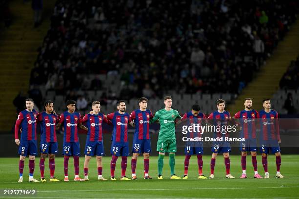Players of FC Barcelona take part in a minutes silence prior to the LaLiga EA Sports match between FC Barcelona and UD Las Palmas at Estadi Olimpic...