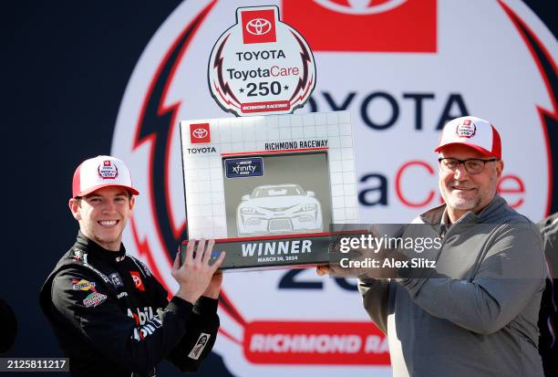 Chandler Smith, driver of the Mobil 1 Toyota, celebrates in victory lane after winning the NASCAR Xfinity Series ToyotaCare 250 at Richmond Raceway...