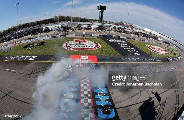 Chandler Smith, driver of the Mobil 1 Toyota, celebrates with a burnout after winning the NASCAR Xfinity Series ToyotaCare 250 at Richmond Raceway on...