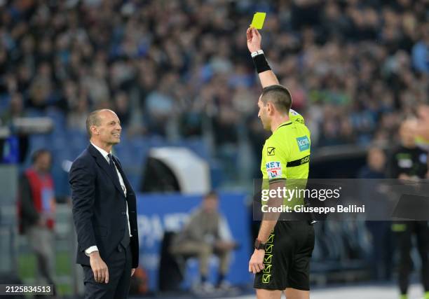 Referee Andrea Colombo shows yellow card to Massimiliano Allegri head coach of Juventus during the Serie A TIM match between SS Lazio and Juventus at...