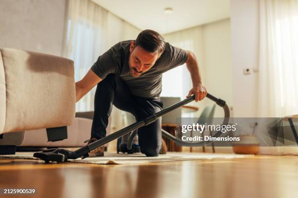 intensive cleaning effort at home - dammsugare bildbanksfoton och bilder