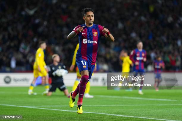 Raphinha of FC Barcelona celebrates scoring his team's first goal during the LaLiga EA Sports match between FC Barcelona and UD Las Palmas at Estadi...