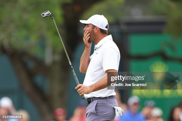 Scottie Scheffler of the United States reacts to a putt on the 16th green during the third round of the Texas Children's Houston Open at Memorial...