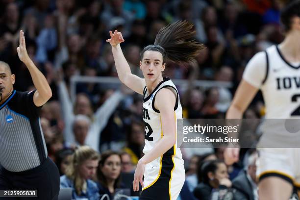 Caitlin Clark of the Iowa Hawkeyes celebrates after scoring a three pointer against the Colorado Buffaloes during the second half in the Sweet 16...