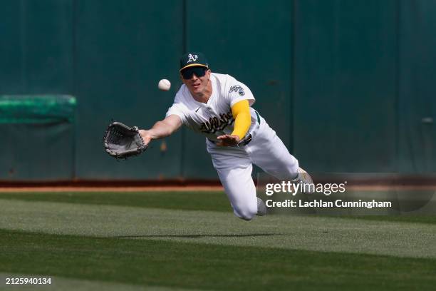 Bleday of the Oakland Athletics catches a line drive hit by Tyler Freeman of the Cleveland Guardians in the top of the fifth inning at Oakland...