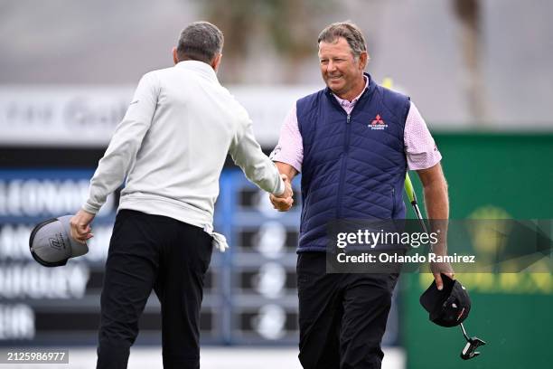 Retief Goosen of South Africa, right, and Steven Alker of New Zealand shake hands after completing their tsecond round of The Galleri Classic at...