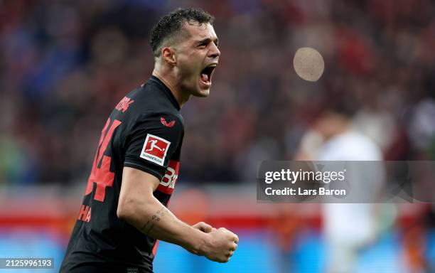 Granit Xhaka of Bayer Leverkusen celebrates during the Bundesliga match between Bayer 04 Leverkusen and TSG Hoffenheim at BayArena on March 30, 2024...
