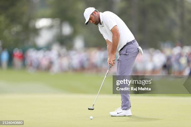 Scottie Scheffler of the United States putts on the 18th green during the third round of the Texas Children's Houston Open at Memorial Park Golf...