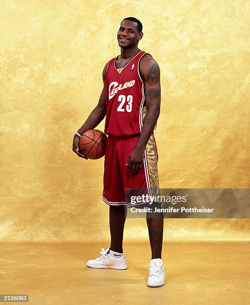 LeBron James poses for a portrait prior to the draft in the red and gold Cleveland Cavaliers uniform for Media Availability Portraits at the Westin...