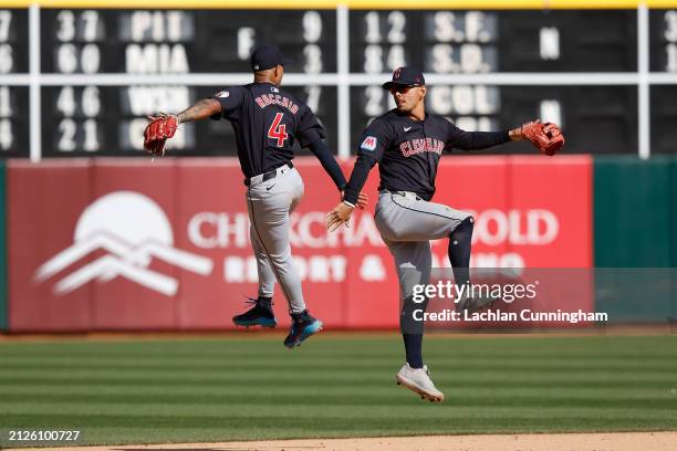 Brayan Rocchio and Andres Gimenez of the Cleveland Guardians celebrate after a win against the Oakland Athletics at Oakland Coliseum on March 30,...