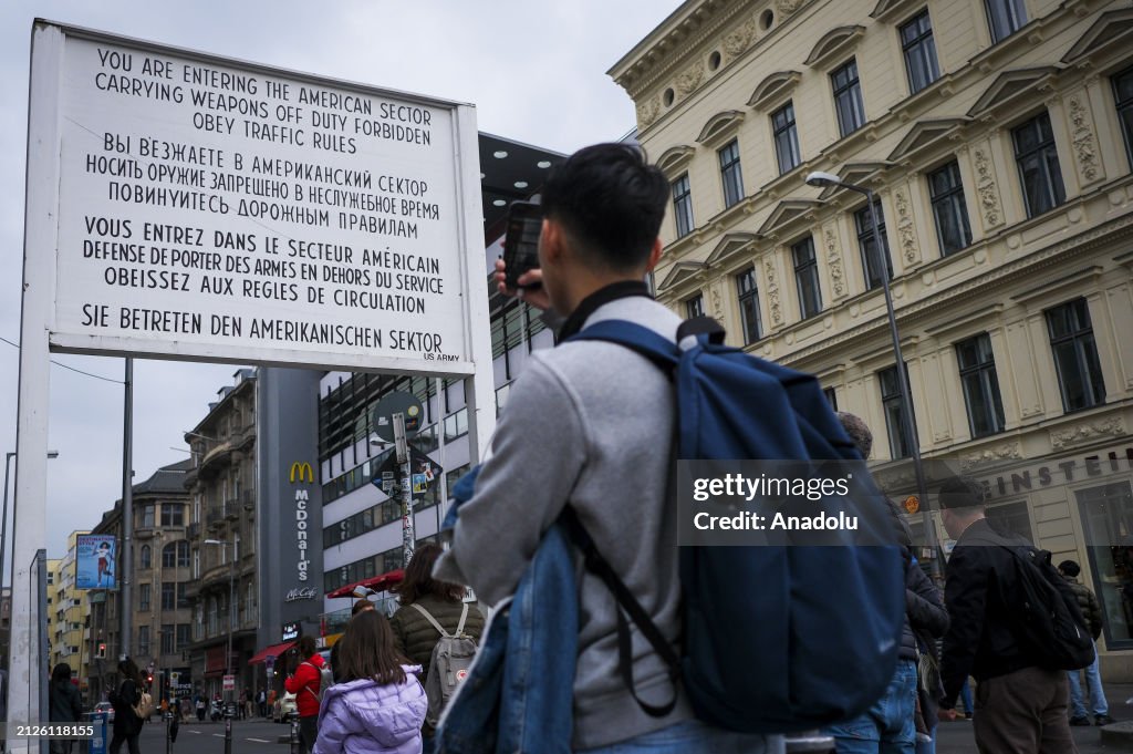 Checkp Point Charlie Inages People take photograph as they visit the Checkpoint Charlie, used to ...