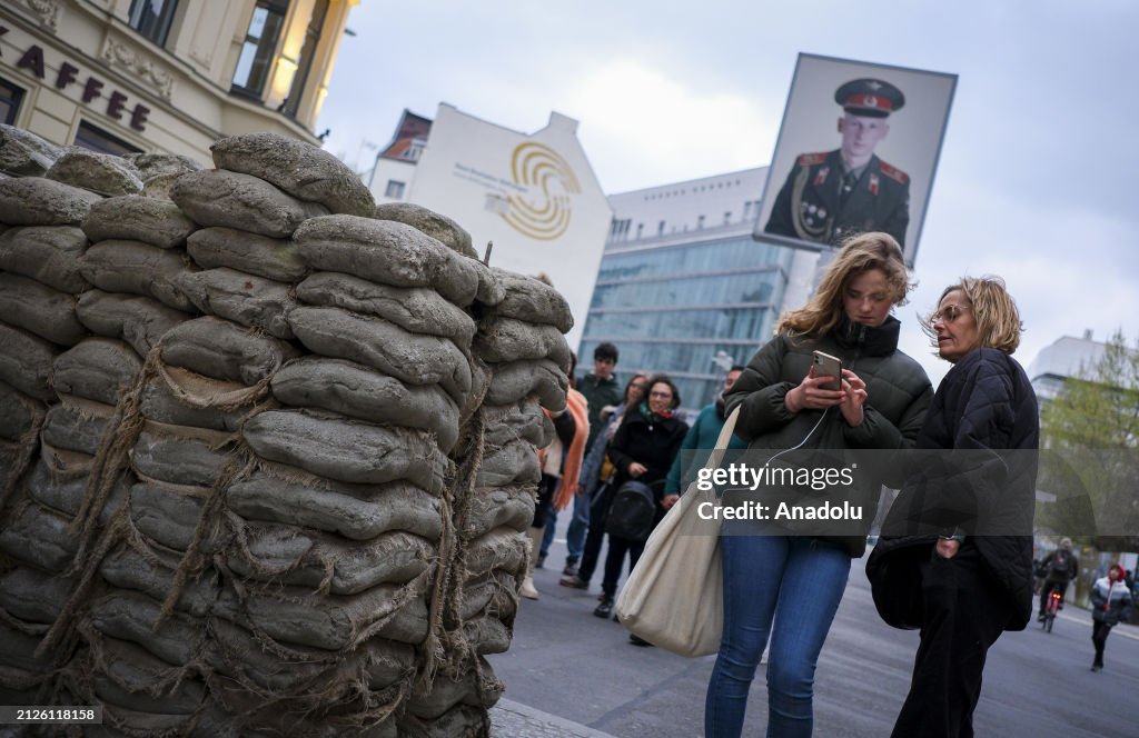 Checkp Point Charlie Inages People visit the Checkpoint Charlie, used to be a transit point... News ...