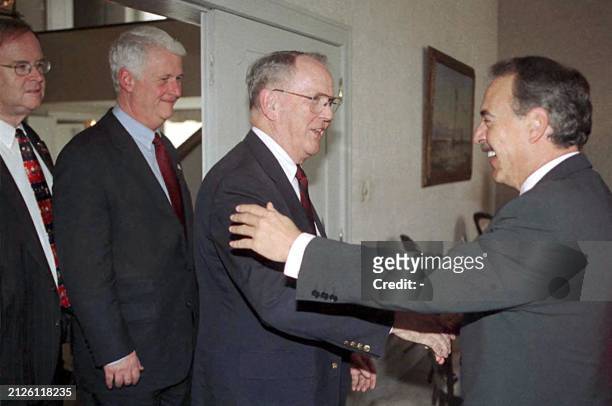 Colombian President Andres Pastrana greets US congressmen Cass Ballenger, William Delahunt and Sam Farr 18 January before a meeting in Bogota. El...
