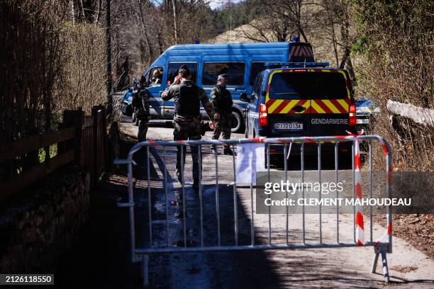French Gendarmes secure a perimeter around the French southern Alps tiny village of Le Haut-Vernet, in Le Vernet on April 2 two days after French...