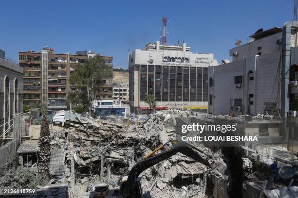 The rubble of a building annexed to the Iranian embassy is pictured a day after an air strike in Damascus on April 2, 2024. Iran warned arch foe...