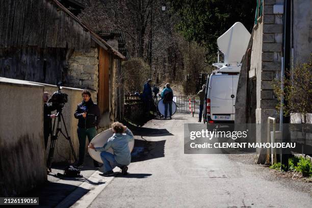 Journalists are at work in the French southern Alps tiny village of Le Haut-Vernet, in Le Vernet on April 2 two days after French investigators have...