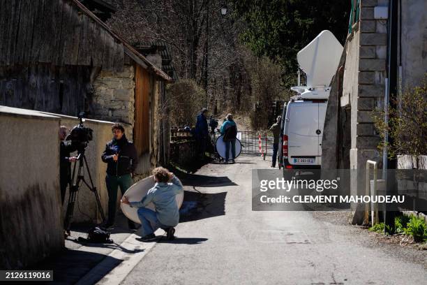 Journalists are at work in the French southern Alps tiny village of Le Haut-Vernet, in Le Vernet on April 2 two days after French investigators have...