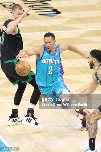 Grant Williams of the Charlotte Hornets handles the ball during the game against the Boston Celtics on April 1, 2024 at Spectrum Center in Charlotte,...