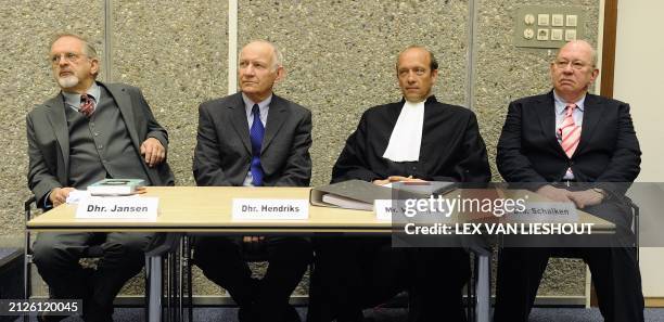 Expert witnesses Arabist Hans Jansen and Middle East expert Bertus Hendriks sit with lawyer Van Eijck and Tom Schalken, co-author of the prosecutions...