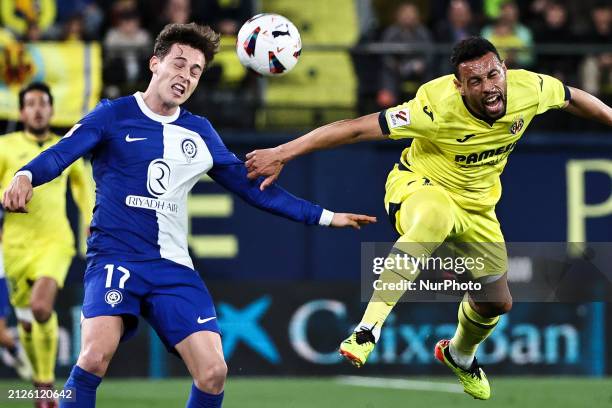 Rodrigo Riquelme of Atletico de Madrid is competing against Francis Joseph Coquelin of Villarreal during the La Liga match between Villarreal CF and...