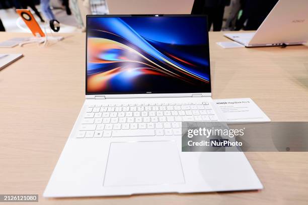 The Honor Magic Book Pro16, the latest laptop designed by the Chinese manufacturer, is being displayed in white at the Mobile World Congress 2024 in...