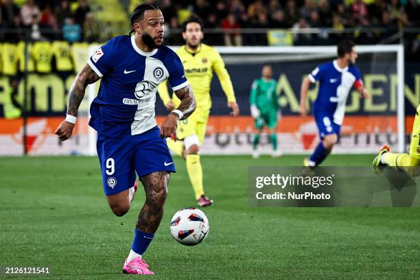 Memphis Depay of Atletico de Madrid is playing during the La Liga match between Villarreal CF and Atletico de Madrid at La Ceramica Stadium in...