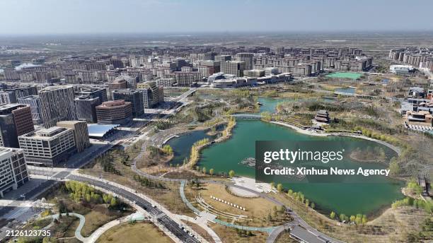 An aerial drone photo taken on March 29, 2024 shows a view of the Jinhu park in Xiong'an New Area, north China's Hebei Province. In April 2017, China...