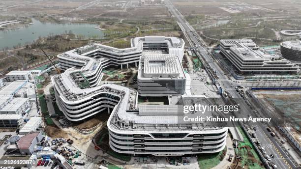 An aerial drone photo taken on March 28, 2024 shows the construction site of the headquarters of China Satellite Network Group in Xiong'an New Area,...