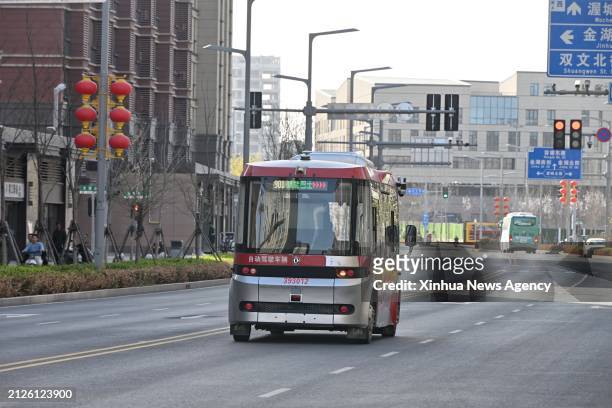 An intelligent connected bus runs on a road in Rongdong area of Xiong'an New Area, north China's Hebei Province, March 29, 2024. In April 2017, China...