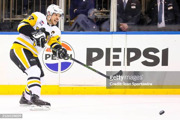 Pittsburgh Penguins Center Sidney Crosby makes a pass during the National Hockey League game between the Pittsburgh Penguins and the New York Rangers...