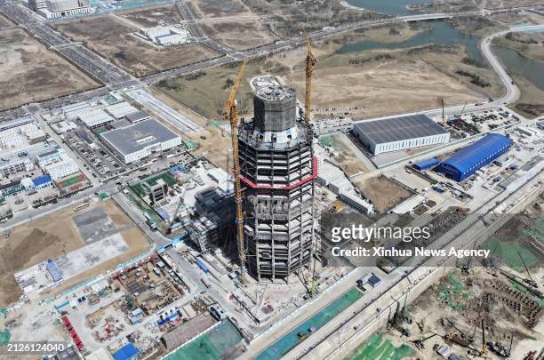 An aerial drone photo taken on March 29, 2024 shows the construction site of Sinochem Holdings buildings in Xiong'an New Area, north China's Hebei...