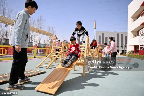 Children play at a kindergarten in Xiong'an New Area, north China's Hebei Province, March 29, 2024. In April 2017, China announced a plan to...