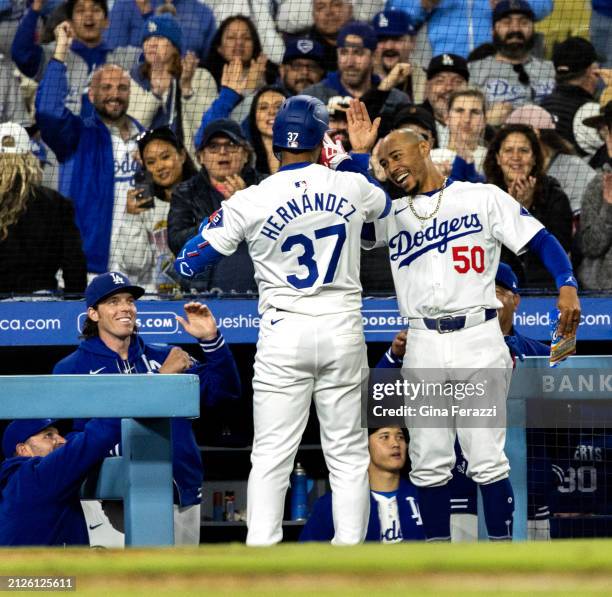 Los Angeles Dodgers shortstop Mookie Betts congratulates left fielder Teoscar Hernandez after he hit a three-run homer off San Francisco Giants...