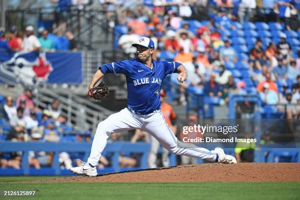 Brandon Eisert of the Toronto Blue Jays throws a pitch during the eighth inning of a spring training game against the Baltimore Orioles at TD...