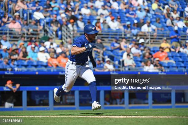 Rafael Lantigua of the Toronto Blue Jays runs out a single during the eighth inning of a spring training game against the Baltimore Orioles at TD...