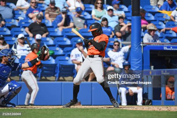 Errol Robinson of the Baltimore Orioles avoids a close pitch during the eighth inning of a spring training game against the Toronto Blue Jays at TD...