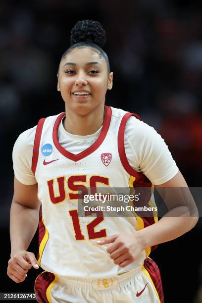 JuJu Watkins of the USC Trojans smiles after a play during the second half against the Baylor Lady Bears in the Sweet 16 round of the NCAA Women's...