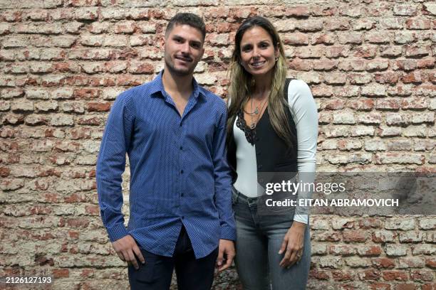 Members of Somos Todos Uruguayos NGO, Ileana Martin , and her son, Oscar Carsi, pose for a picture in Montevideo on March 21, 2024. Statelessness,...