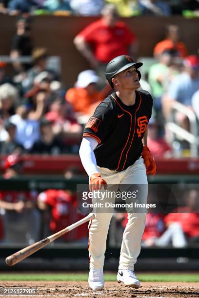 Matt Chapman of the San Francisco Giants runs out a fly ball during the third inning of a spring training game against the Cincinnati Reds at...