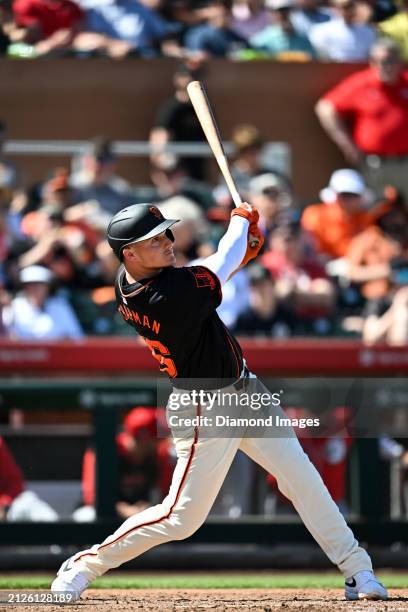 Matt Chapman of the San Francisco Giants bats during the third inning of a spring training game against the Cincinnati Reds at Scottsdale Stadium on...