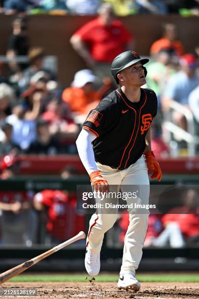 Matt Chapman of the San Francisco Giants runs out a fly ball during the third inning of a spring training game against the Cincinnati Reds at...