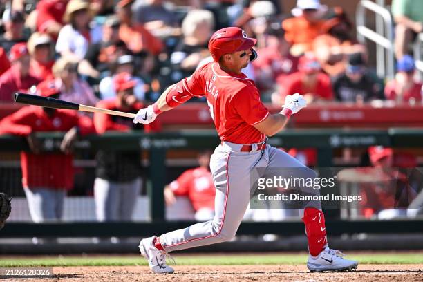 Spencer Steer of the Cincinnati Reds hits a single during the fourth inning of a spring training game against the San Francisco Giants at Scottsdale...