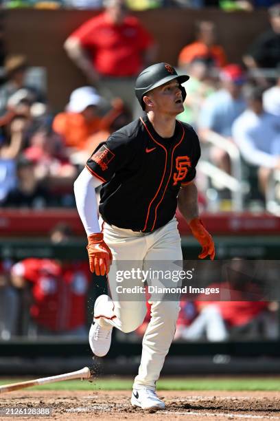 Matt Chapman of the San Francisco Giants runs out a fly ball during the third inning of a spring training game against the Cincinnati Reds at...